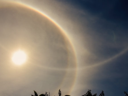 View of an awesome double circle solar halo happening over the eastern Andean mountains of central Colombia, in an almost midday sky.の写真素材