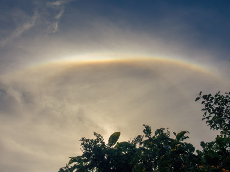 View of an awesome double circle solar halo happening over the eastern Andean mountains of central Colombia, in an almost midday sky.の写真素材