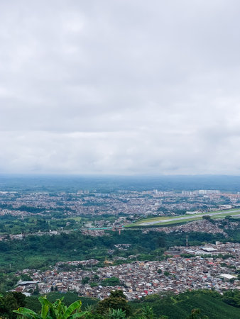aerial view of the MatecaÃ±a international airport located in the city of Pereira, Risaralda-Colombia, in a cloudy day with heavy rains, its runway is empty. aerial conceptの写真素材