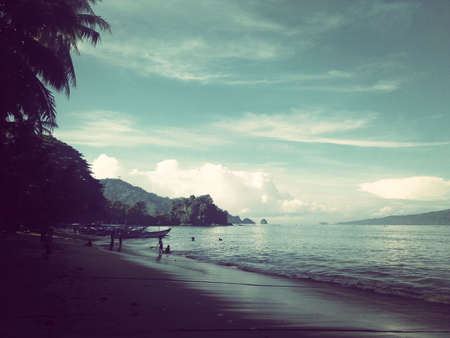 beautiful beach in the morning calm feel, fishing boats are stoppingの写真素材