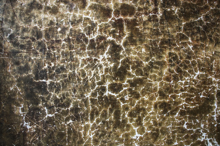 The plaster on the wall is brown and white colors