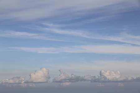 Blue sky and clouds of light pink color