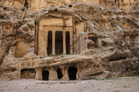 Little Petra in Siq al-Barid, Wadi Musa, Jordan. The architectural ensemble Little Petra is the temples cut in the rocks, altars, stairs, rooms, ritual roomsの写真素材