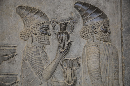 Bas-relief depicts ambassadors bearing gifts to the king. Ancient city of Persepolis. Ancient Persia. Iran.のeditorial素材