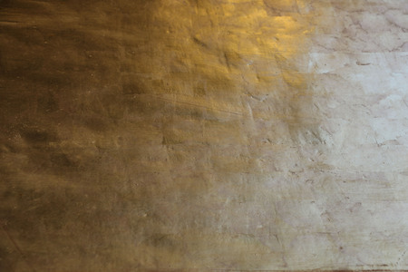 Gold wall texture background with dimming elementsの写真素材