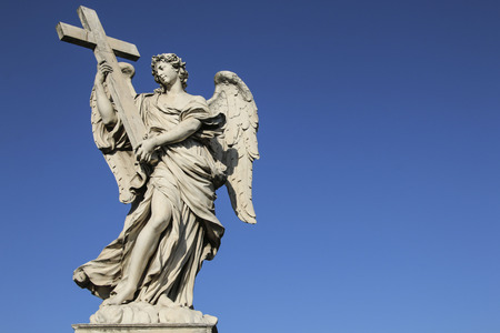 Medieval figure of an angel on the famous bridge Saint Angelo bridge, Rome, Italyの写真素材