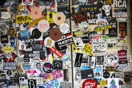 TOKYO, JAPAN - MARCH 25, 2019: Tokyo covered numerous multicolored stickers. Tokyo, Japan,