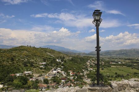 One of the beautiful forged lantern along paved road leading to historic ruins Rozafa Castle in...