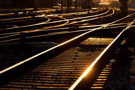 Urban Landscape / Crossing tracks at a station at dawnの写真素材