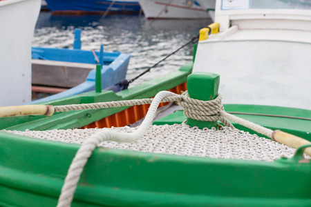 colorful fishing boats moored in the harborの写真素材