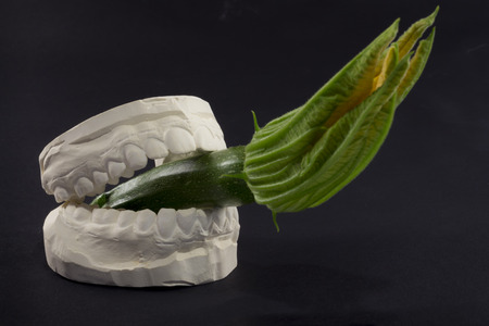 A cigarette in his mouth that harms the health of our teethの写真素材