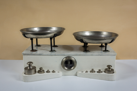 Balance with two metal plates with weightsの写真素材