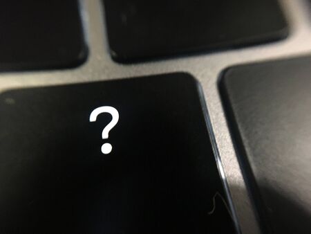 Question mark at the computer keyの写真素材