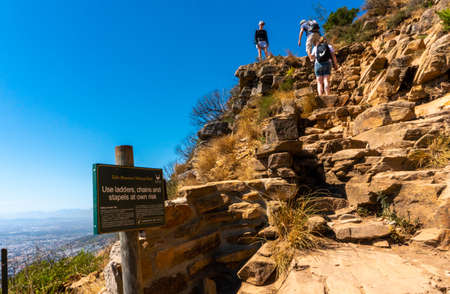 Hikers or tourists ascending Lions Head mountain