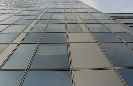 The wall of skyscraper  with a lot of office windows
