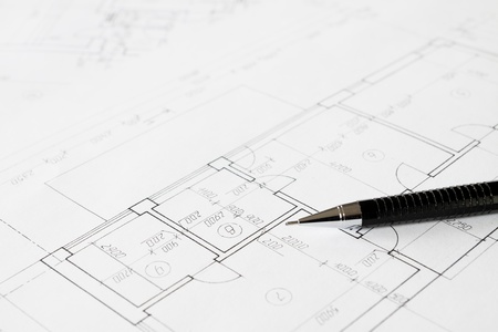 Plans and black pencil on the tableの写真素材