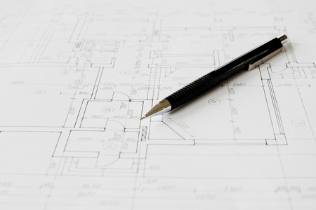 Plans and black pencil on the table