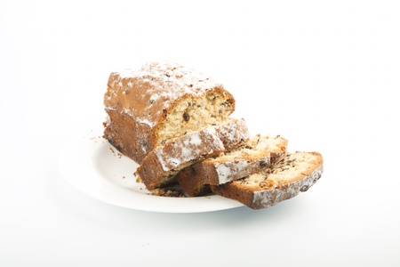 Raisin cake on plate isolated on white backgroundの写真素材