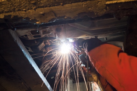 Welding works in the repair shop