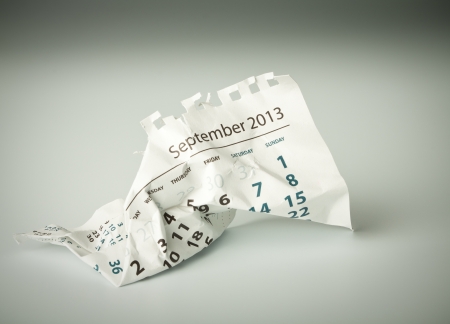 September. Calendar sheet. Crumpled paper on the floor.の写真素材