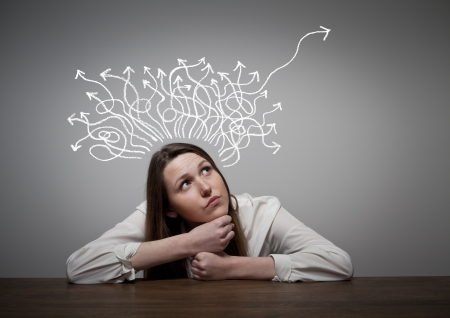 Thinking. Girl solving a problem.の写真素材