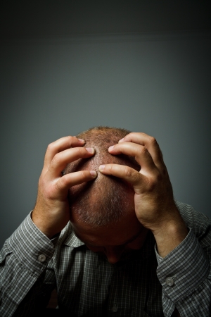 Headache. Expressions, feelings and moods. Man suffering from headacheの写真素材