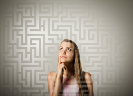 Woman looking for the solution. Young woman is doing something.の写真素材