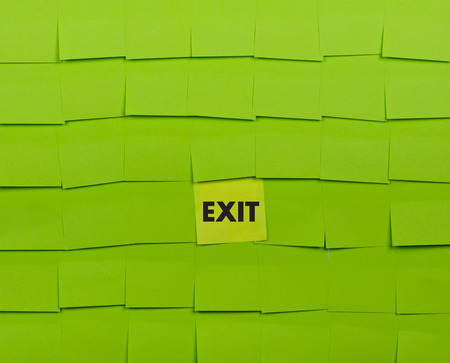 Exit concept. Background of green sticky notes.の写真素材