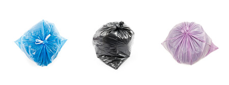 A set of colored garbage bags isolated on white background. Three garbage bags.