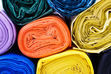 Colored garbage bags on white backgroundの写真素材