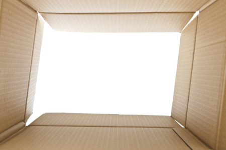 View from inside a cardboard box. White light outsideの写真素材