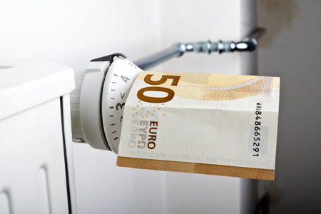 Radiator and Euro. Money on heating battery.の写真素材