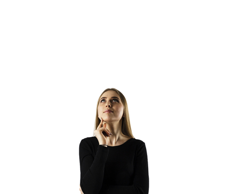 Young attractive woman in black on white background.