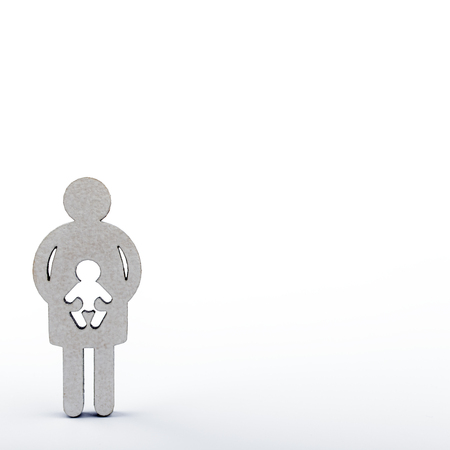 Mother and child. Wooden figures isolated on white background. Pregnancy, abortion or adoption concept.の写真素材