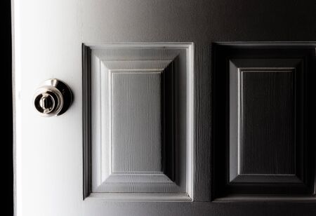 Open door with bright light outside.の写真素材