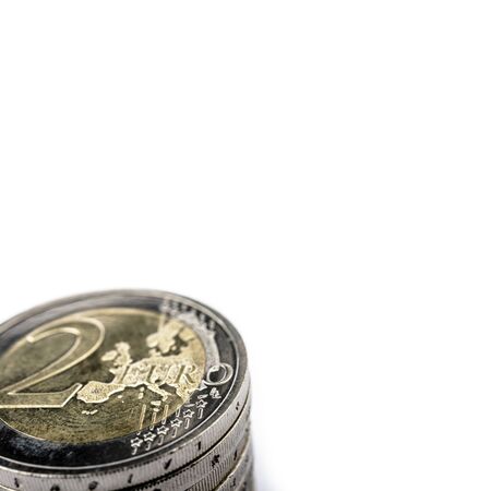 Pile of euro coins isolated on white background. Stack of euro coins. Save money and accumulate wealth. Macro.の写真素材