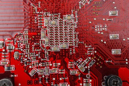 Graphic card. Part of red graphic card as background. Technology and Electronics Industry. Macro.
