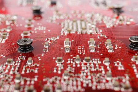 Graphic card. Part of red graphic card as background. Technology and Electronics Industry. Macro.