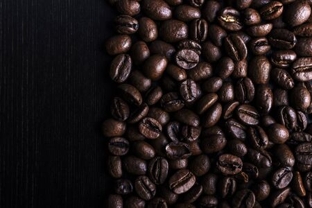 Coffee beans on wooden background. Macro.の写真素材
