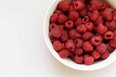 Fresh raspberries in a plate. Natural raspberries. Macro.