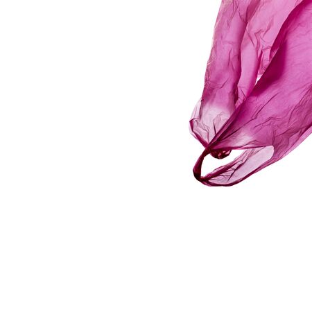Pink plastic shopping bag isolated on white background. Plastic shopping bag in motion.