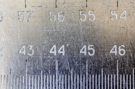 Metal ruler with digits and scale. Macro shoot.の写真素材