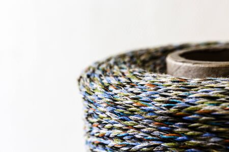 Colourful thread spool. Spool of thread. Thread texture.