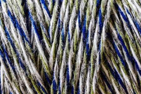 Colourful thread spool. Spool of thread. Thread texture.