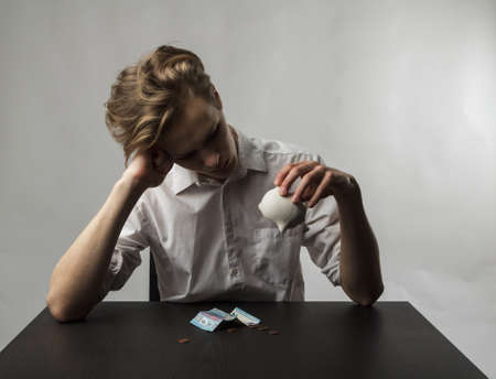 Young man and piggy bank. Financial security planning concept.