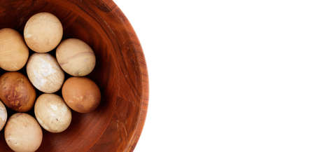 Easter eggs. Colored easter eggs in a bowl on white background with copy space.の写真素材