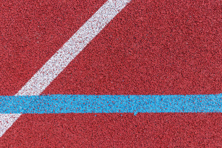 Basketball court lines. Top view to brown field rubber ground with white and blue lines.の写真素材