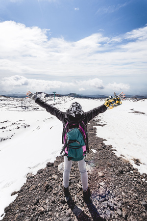 Woman at the top of mountainの写真素材