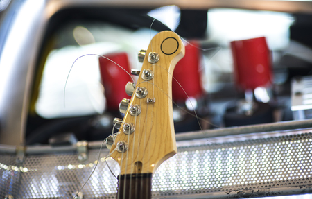 Headstock of the six string classic electric guitar on blurred backgroundの写真素材