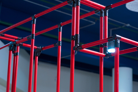 Industrial background - red plastic corrugated pipes